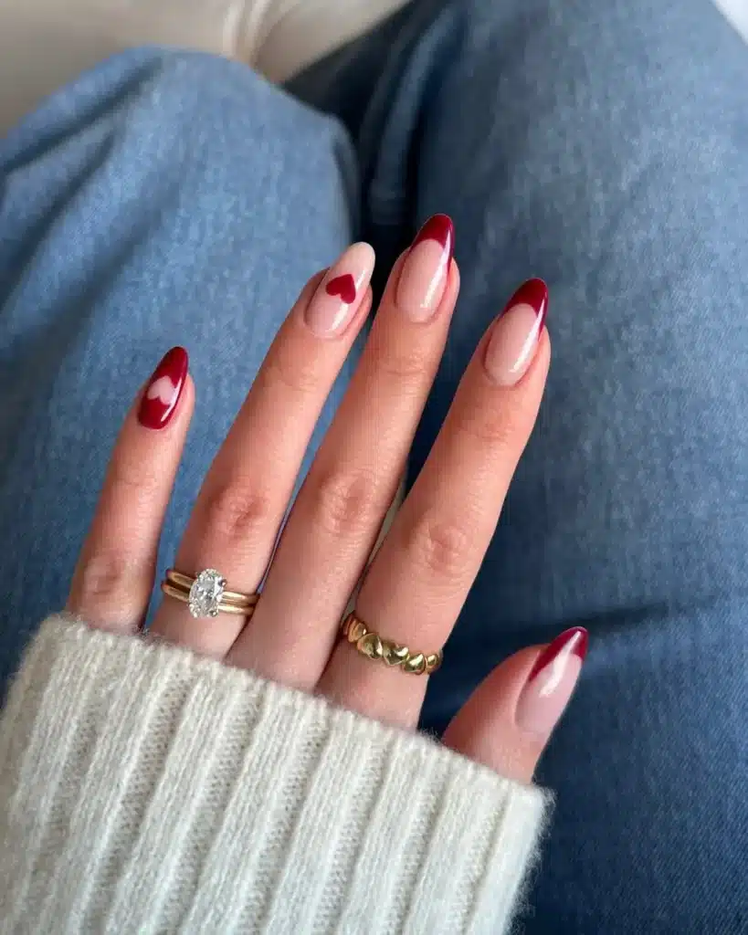 Classic Red French Tip Nails with Heart Details for a Timeless Valentine's Day Look