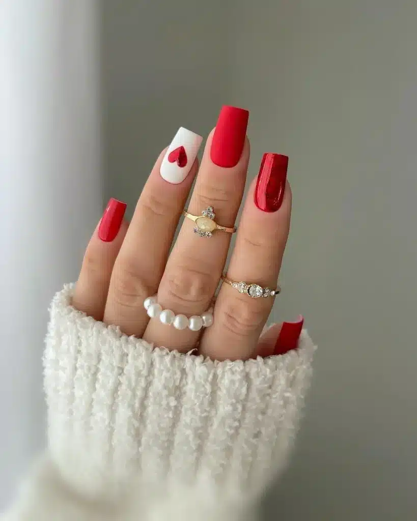 Classic Red and White Nails with Heart Detail and Elegant Pearl Ring Accent