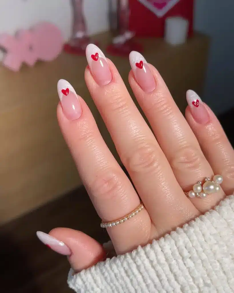 French Manicure with Red Heart Tips and Shimmer for Romantic Valentine's Day Nails