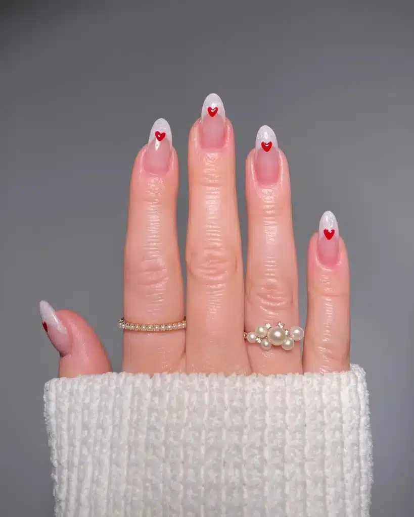 Soft Pink Nails with Heart Details and Elegant Pearl Rings for Romantic Valentine's Day Nails