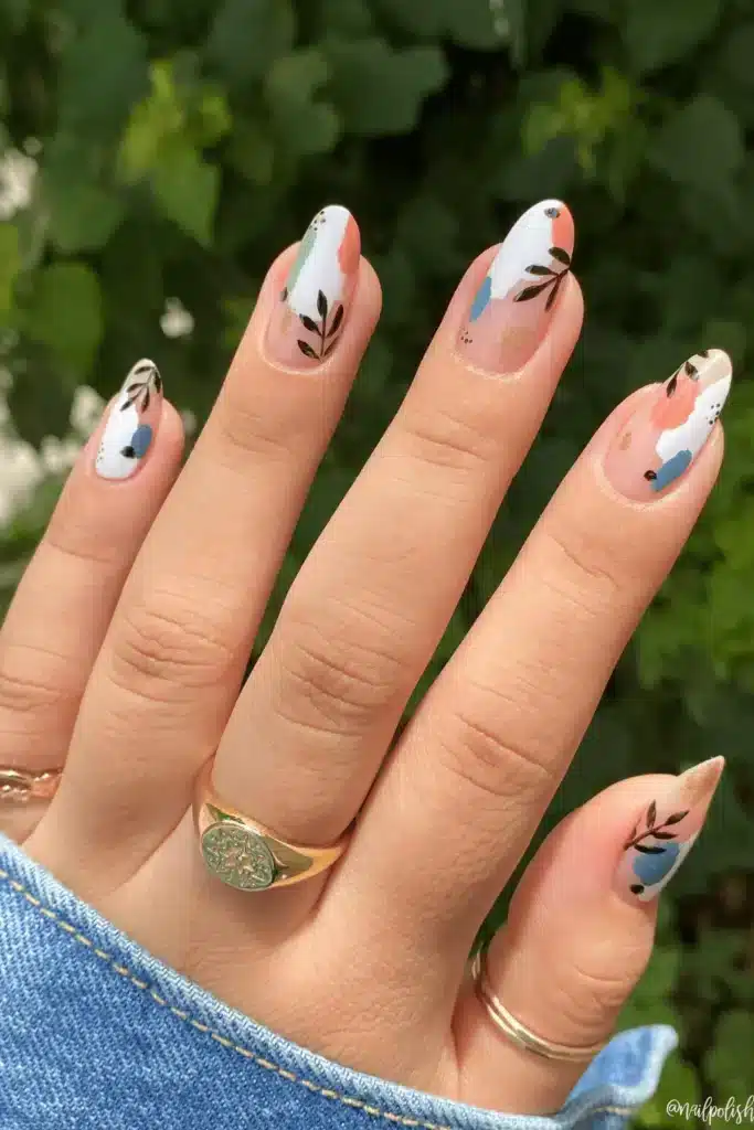 Abstract Nature Art nail design featuring organic shapes, earthy tones, and artistic brushstroke patterns for a modern spring manicure.