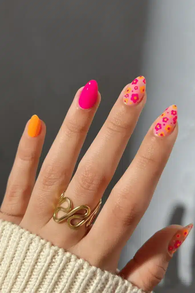 Citrus Blossom Pop spring nail design featuring vibrant orange, yellow, and floral accents for a fresh, trendy manicure.