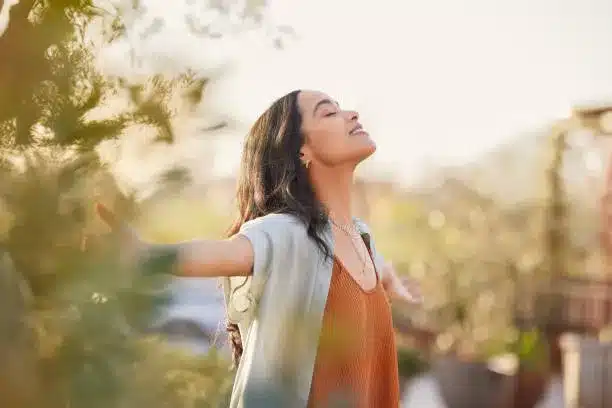 Person with eyes closed visualizing color breathing for anxiety relief