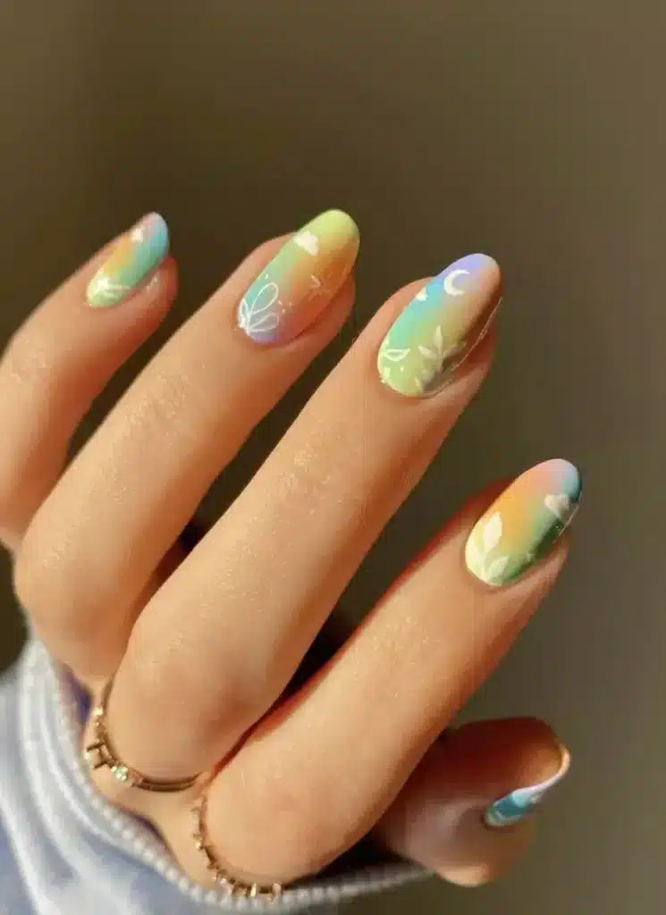 Ethereal Garden nail design featuring soft pastel flowers, delicate greenery, and a dreamy, nature-inspired aesthetic for a fresh spring look.
