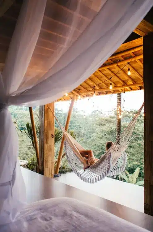 Cozy hammock setup with blankets and fairy lights for outdoor relaxation ritual