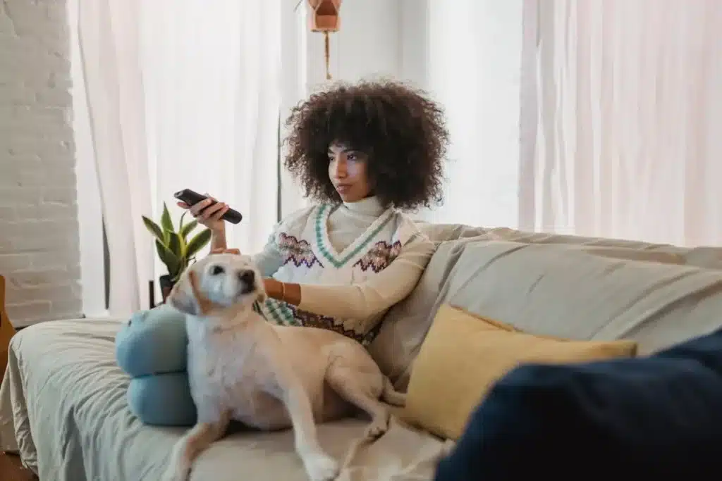 Person watching inspiring TED talk as educational self-care activity