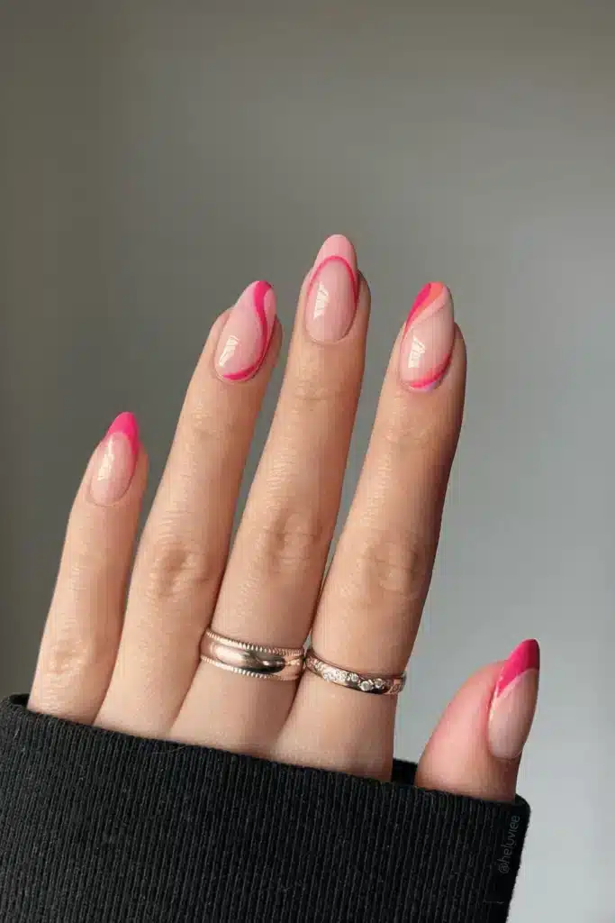 Pink Sunrise Swirls nail design featuring soft pink and peach hues with elegant swirl patterns for a dreamy sunrise-inspired look.
