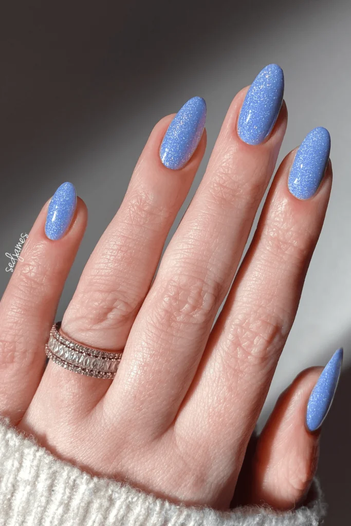 Sparkly Sky Blue Dreams nail design featuring a shimmering sky blue base with subtle glitter accents for a dreamy, celestial look.