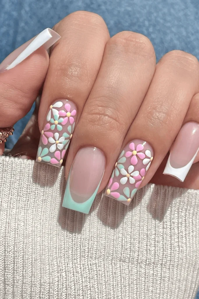 Spring Garden French Tips nail design featuring a classic French tip manicure with soft pastel floral accents for a fresh, spring-inspired look.