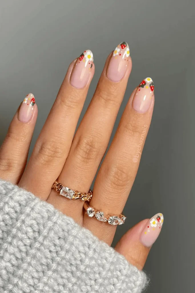 Strawberry Meadow Magic nail design featuring vibrant strawberry accents and lush green hues for a fresh, nature-inspired look.