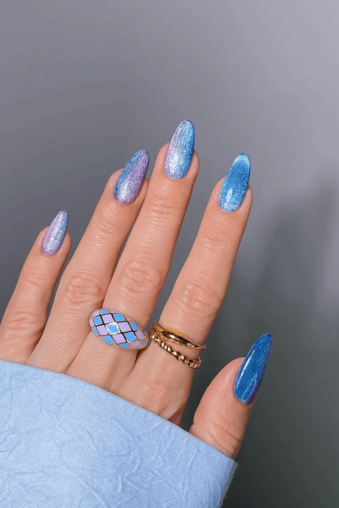 Twilight Galaxy Glitter nail design featuring deep purple and blue hues with sparkling glitter for a cosmic, celestial-inspired look.