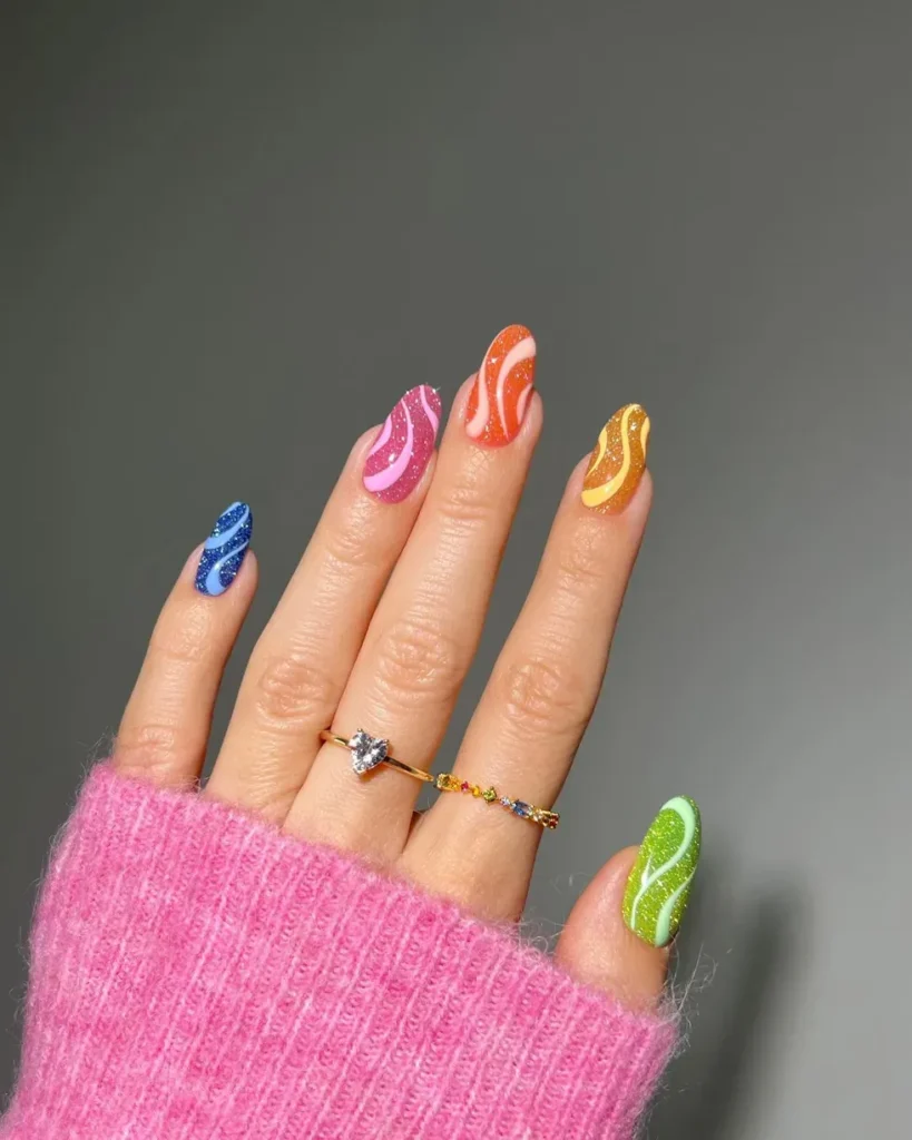 Vibrant Wave Swirls nail design featuring bold, swirling colors in vibrant hues for a dynamic, energetic look.
